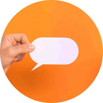 a hand holding a white paper speech bubble against an orange background